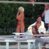 Linda Hogan in an orange bikini...